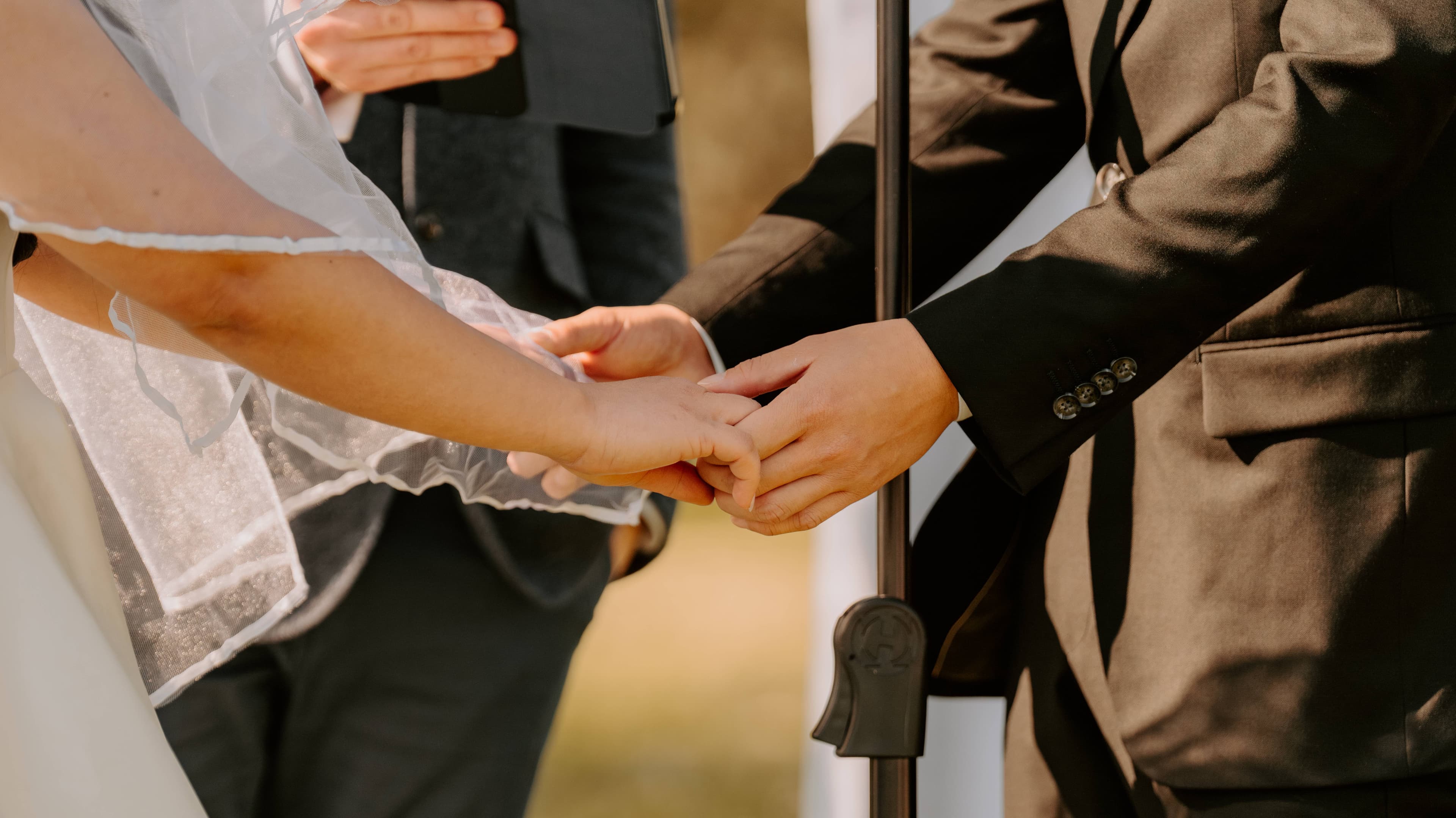 A husband and wife holding each hand