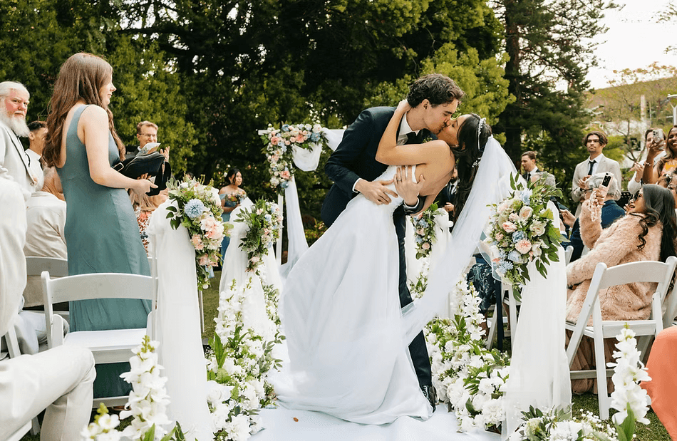 Two couple having a wedding kiss